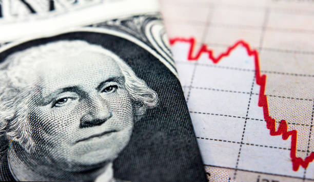 istock Stock market declining chart and US banknote 1446562416