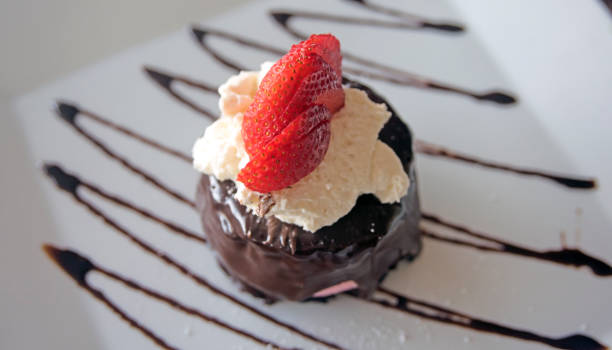 istock Chocolate Strawberry Whipped Cream Dessert on a White Plate with Chocolate Drizzle 1446563418