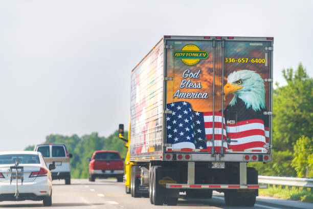 Marion, USA - July 6, 2021: Bottomley Enterprises refrigerated truck delivering cargo freight shipment on interstate highway road in North Carolina