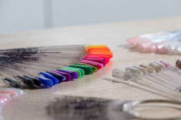 istock Fan-shaped nail gel polish display tips on table in salon 1446564835