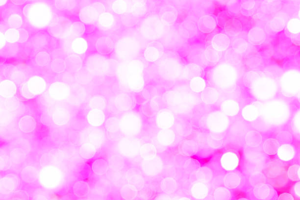 Pink purple glitter bokeh background.