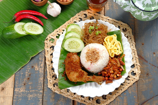 Nasi Uduk Betawi. Coconut flavored steamed rice dish from Betawi, Jakarta.served with several dishes