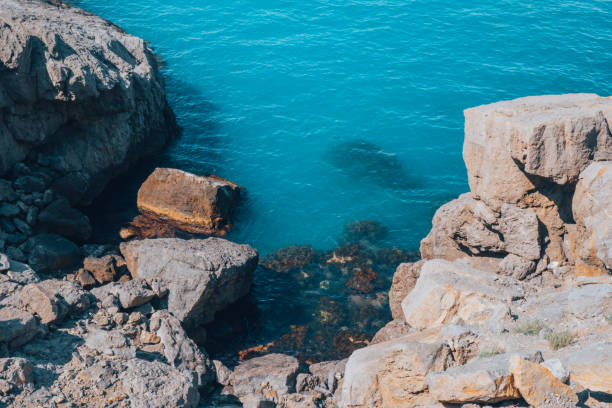 istock Beautiful rocky bay with turquoise sea. 1446583586