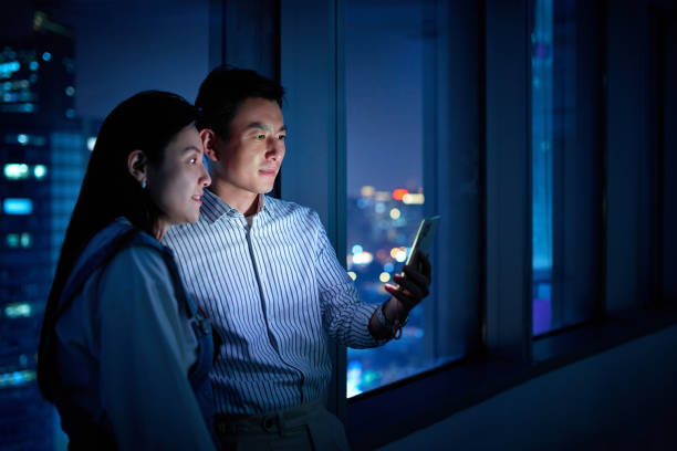 istock Middle Men & Women Looking or Video Calling at Smart Phone 1446590412