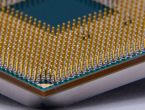Close up photo of a pin grid array central processing unit (PGA CPU).