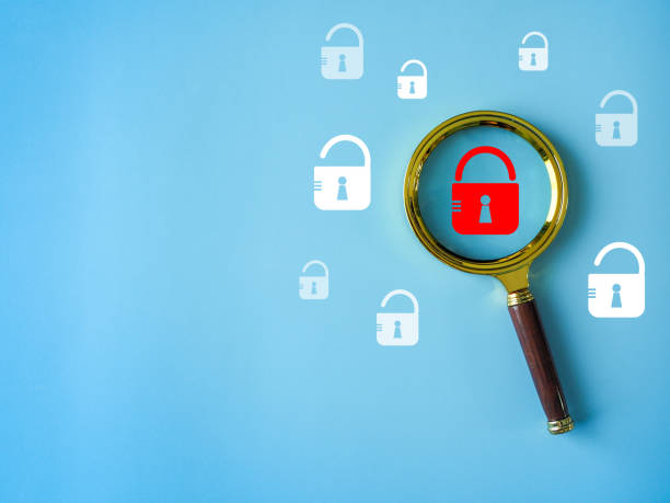 istock Search for security with a magnifying glass, find a security padlock. 1446599930