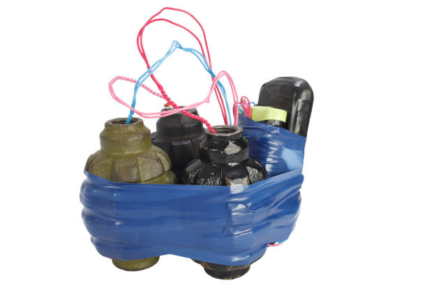 IED. Improvised Explosive Device from hand grenade and cell phone isolated on white