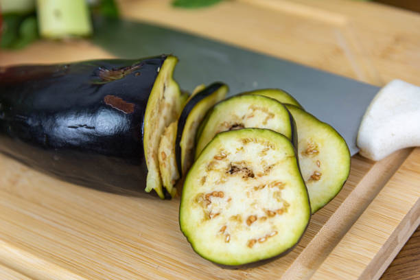 istock Vegetables cut on wooden board. 1446611841