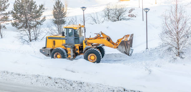 istock Snow clearing. Tractor clears the way after heavy snowfall. 1446615047