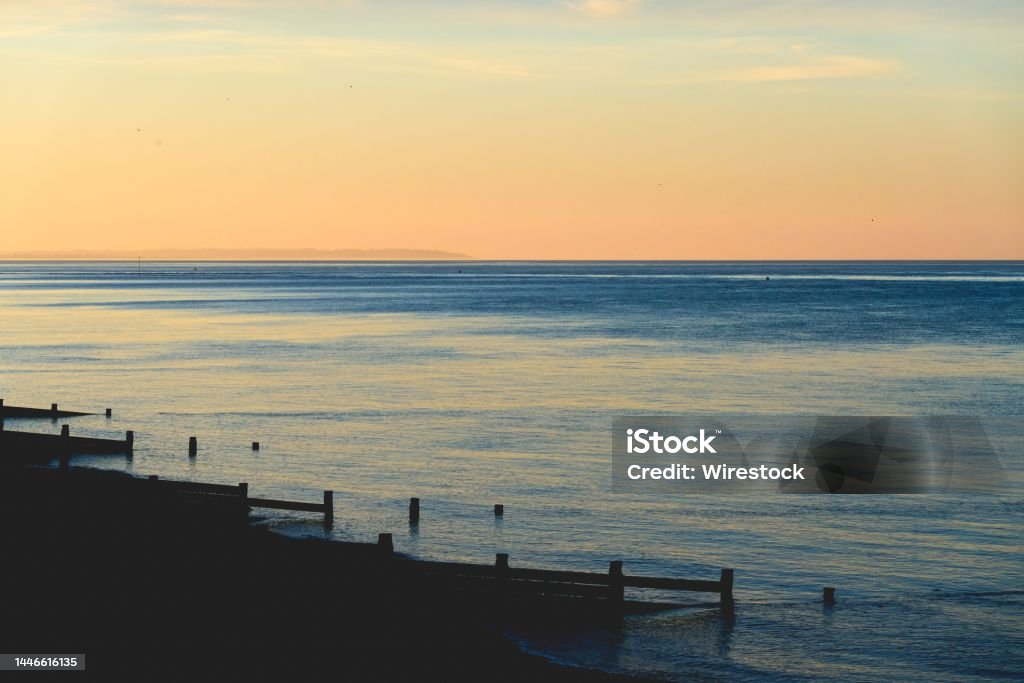 Beautiful sunset off the coast of Herne Bay in the UK A beautiful sunset off the coast of Herne Bay in the UK Beach Stock Photo