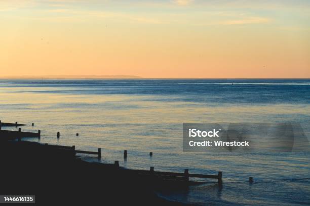 Beautiful Sunset Off The Coast Of Herne Bay In The Uk Stock Photo - Download Image Now