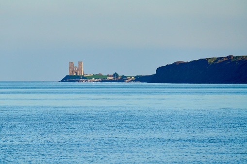 Looking east from Herne Bay towards the ruins of the medieval church at Reculver