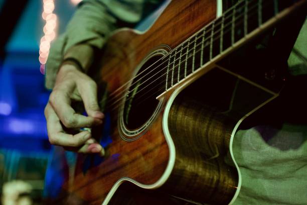 istock Musician playing a brown guitar 1446616565