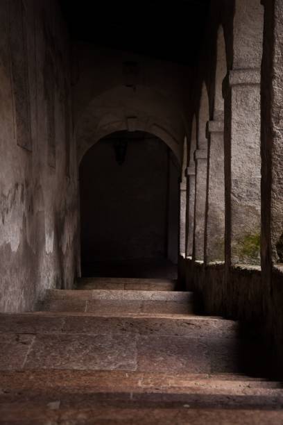 istock Stairway down stairs with an arch entrance 1446616578