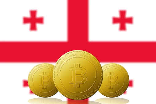 Three Bitcoins cryptocurrency with Georgia flag on background 3D ILLUSTRATION.
