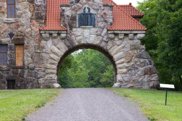 istock Road in front of stony building with arch 1446617040