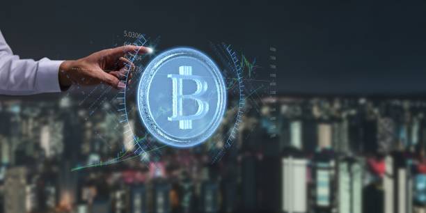 istock Person presenting a virtual projection of the cryptocurrency symbol 1446617062