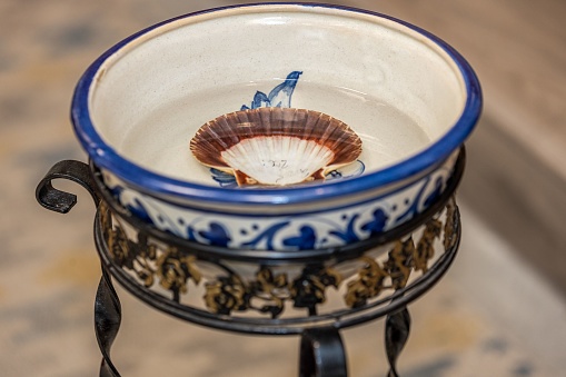 The high-angle view of a baptismal font with water