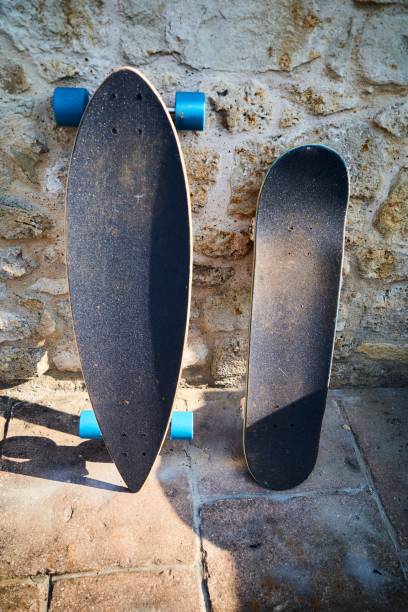 istock Closeup of skateboards leaning on a wall 1446617340