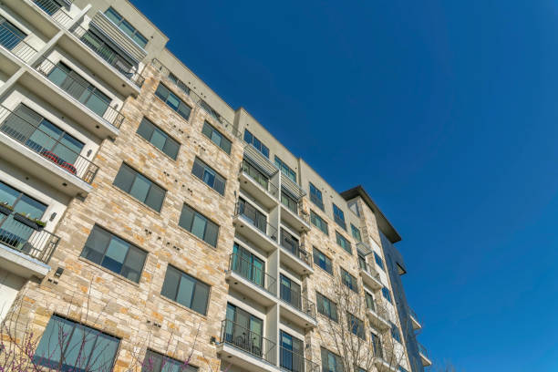 istock Modern luxury apartments with stone brick wall facade and small balconies 1446618519