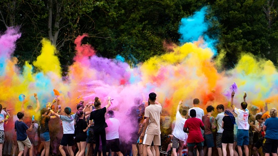 Cambridg, United Kingdom – July 28, 2022: A powder paint party at a festival in Cambridge, United Kingdom.