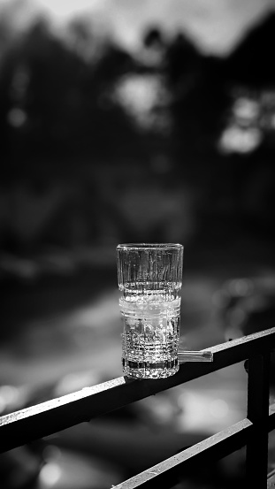 A black and white shot of a glass