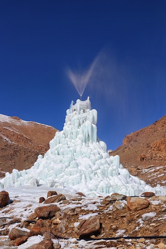 Ice stupa is a form of glacier grafting technique that creates artificial glaciers, used for storing winter water in the form of conical shaped ice heaps. During summer, when water is scarce, the Ice Stupa melts to increase water supply for crops.