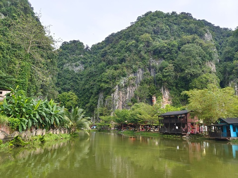 The Qing Xin Ling leisure and cultural village in Malaysia with a scenic lake and green mountains