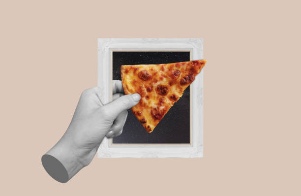 istock Digital collage, Hand holding slice of pizza, with picture frame 1446622440