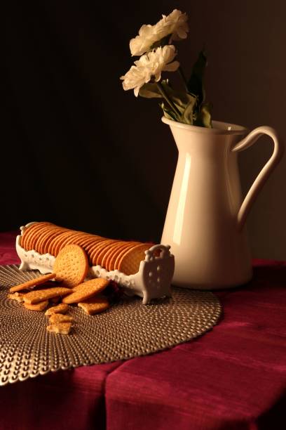 istock Vertical still life of a ceramic vase and cookies. 1446623112