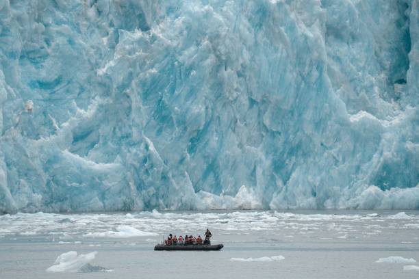 istock Small boat against glaciers in Inside Passage, Alaska 1446624247