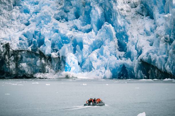 istock Small boat against glaciers in Inside Passage, Alaska 1446624253