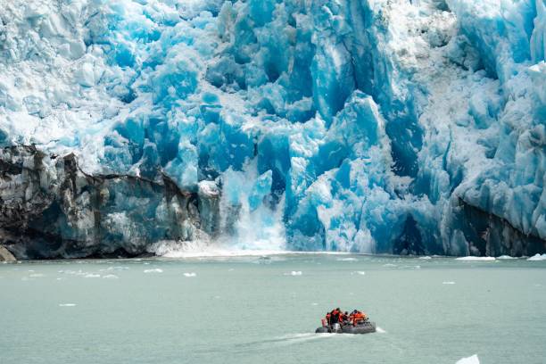istock Small boat against glaciers in Inside Passage, Alaska 1446624255