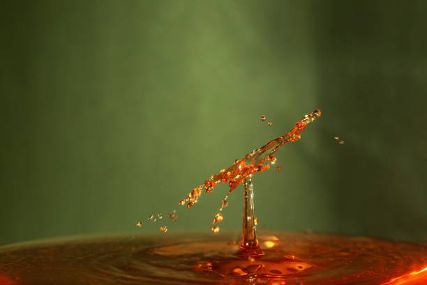 A droplets in orange water with blurry background
