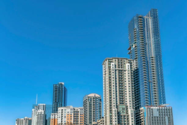 istock Towering modern luxury apartments against blue sky background on a sunny day 1446625774