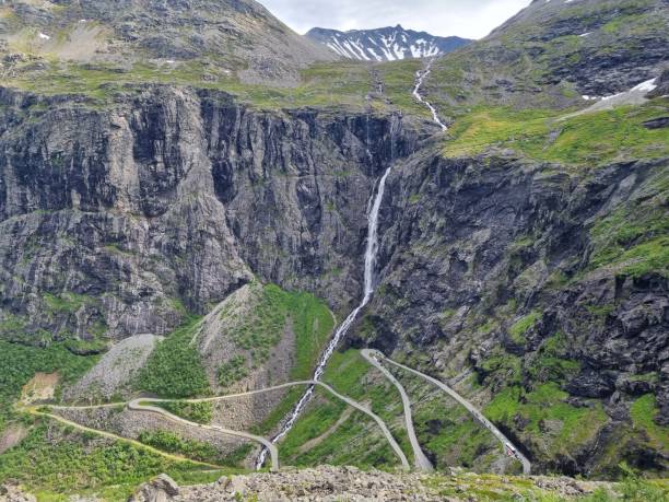 istock Rocky mountains covered with small waterfall, trollstigen, norway 1446626454