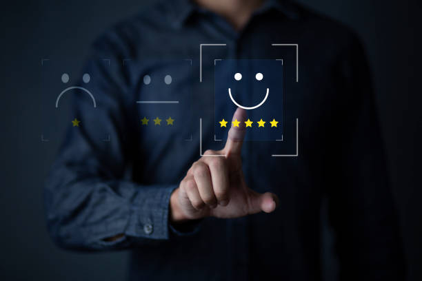 istock Consumers are evaluating their satisfaction with the service. Consumers write reviews about their satisfaction with a product or service. Consumers use the smiley face icon symbol and 5 stars. 1446626579