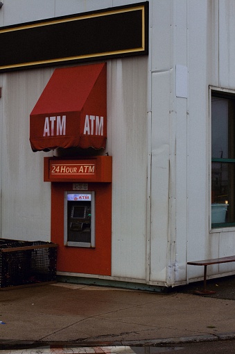 Boston, United States – May 23, 2020: A vertical shot of the Red ATM in south Boston. USA