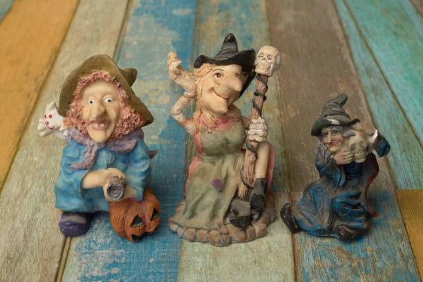 istock Selective focus shot of Witch Figurines on a wooden table 1446629022