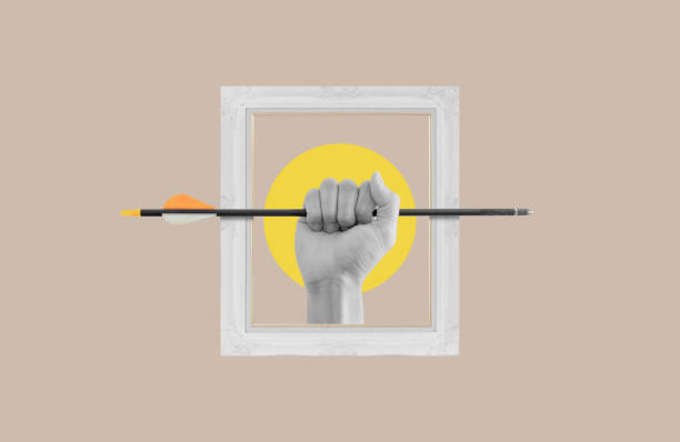 istock Digital collage modern art. Hand holding arrow in picture frame 1446629204