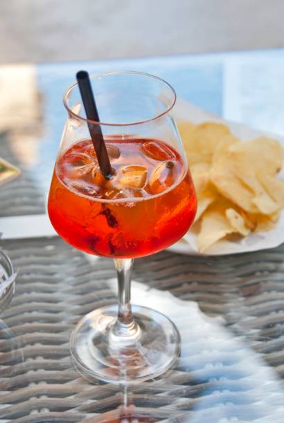 istock Vertical closeup of an orange cocktail on a table 1446629587