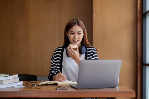 istock Online learning, portrait asian freelancer or smiling woman student using a laptop for a video call with a teacher, distance education concept 1446630033