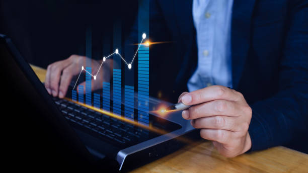 istock Businessman stylus pen touch points symbol stock graph and chart background, concept growth and development business investment, Stock market and strategy making market plan and stock market fluctuations 1446630950