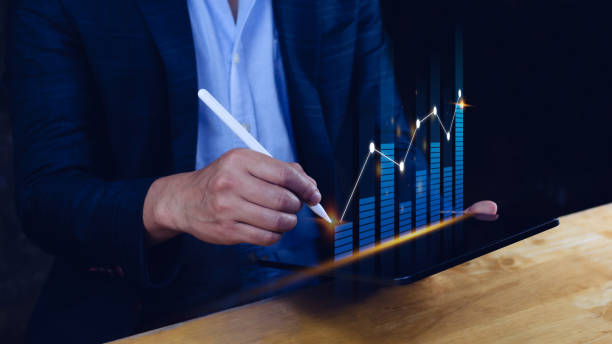 istock Businessman stylus pen touch points symbol stock graph and chart background, concept growth and development business investment, Stock market and strategy making market plan and stock market fluctuations 1446630956