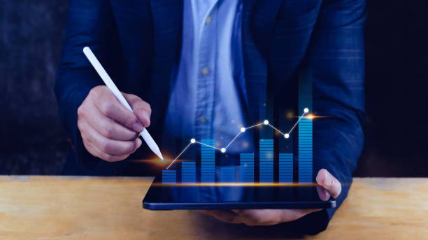 istock Businessman stylus pen touch points symbol stock graph and chart background, concept growth and development business investment, Stock market and strategy making market plan and stock market fluctuations 1446630966