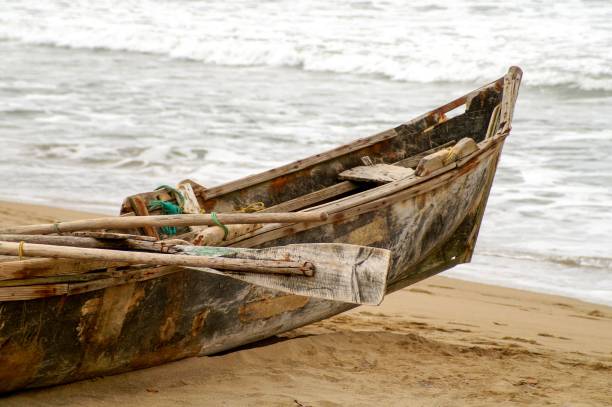 istock Old wooden boat parked on a seashore 1446631418