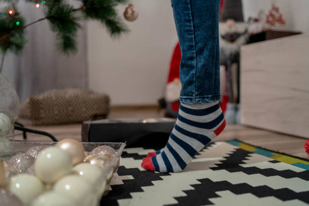 istock Girl feet in Christmas socket standing on fingers 1446633170