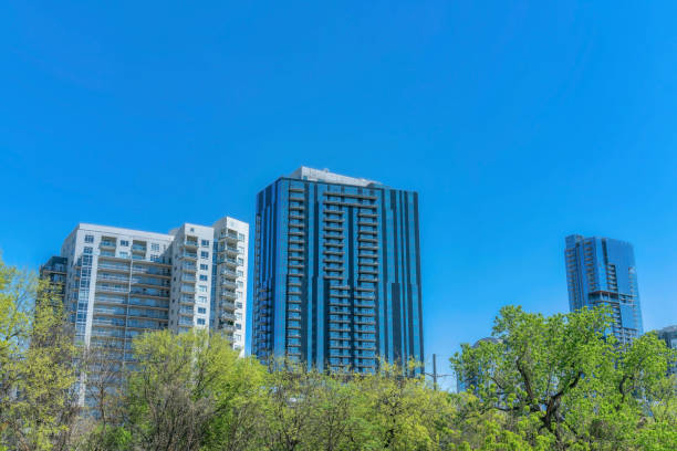 istock Facade of apartment complex with vibrant blue sky background in Austin Texas 1446633178