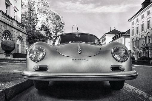 Munich, Germany – November 02, 2017: A grayscale of a vintage Porsche car on a street in Munich