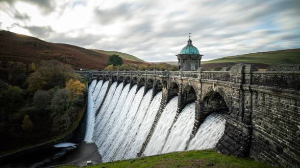 istock Brick wall bridge under a dam in the river 1446633680